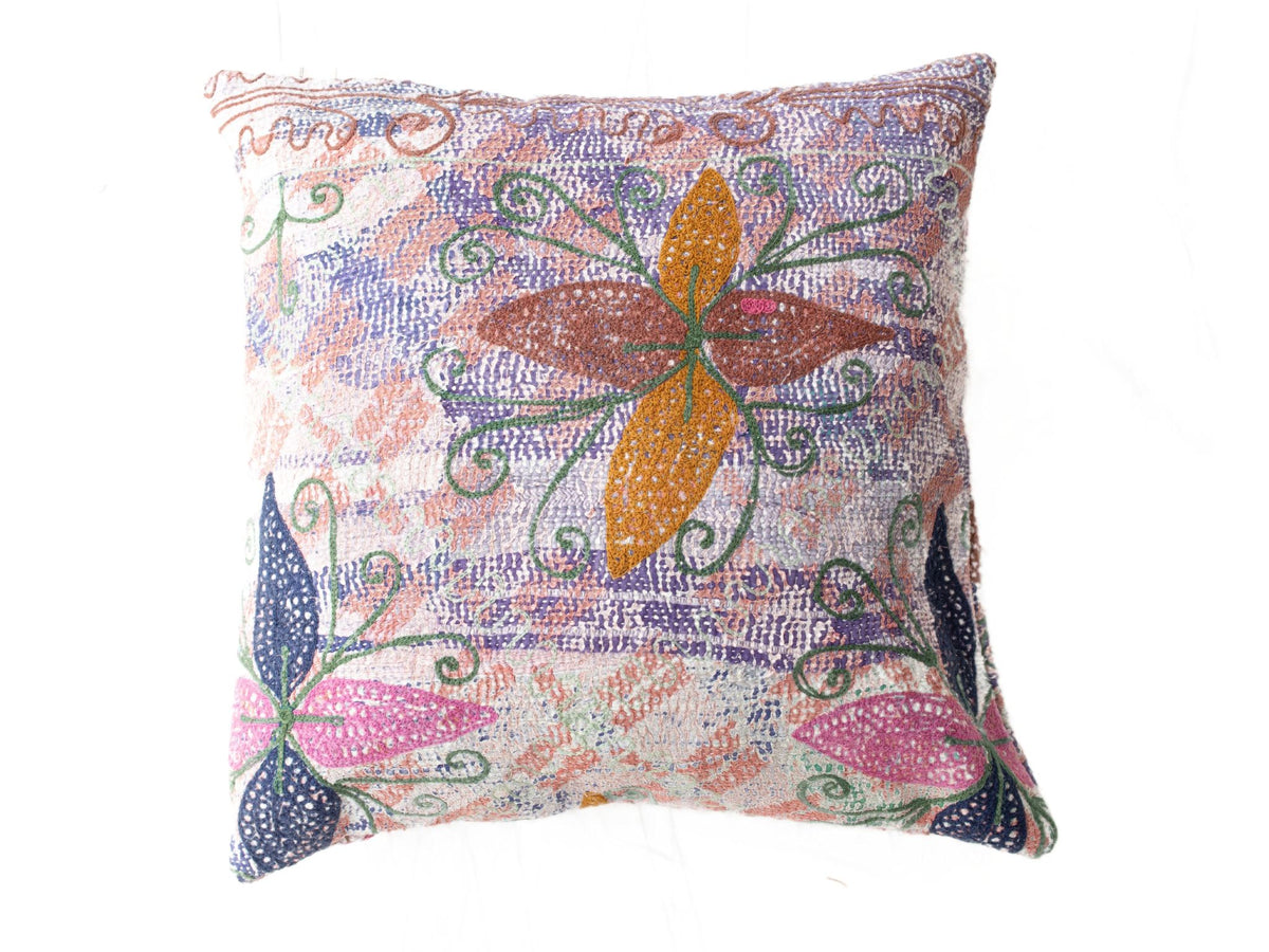 Colorful suzani pillowcase with oriental pattern in purple blue, ochre and green creepers on a light background for sari pillow and vintage boho pillow