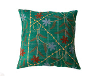 Green suzani pillowcase 50x50 cm in boho-oriental style with checkered stripe pattern and colorful embroidered flowers in brown, red and light blue.